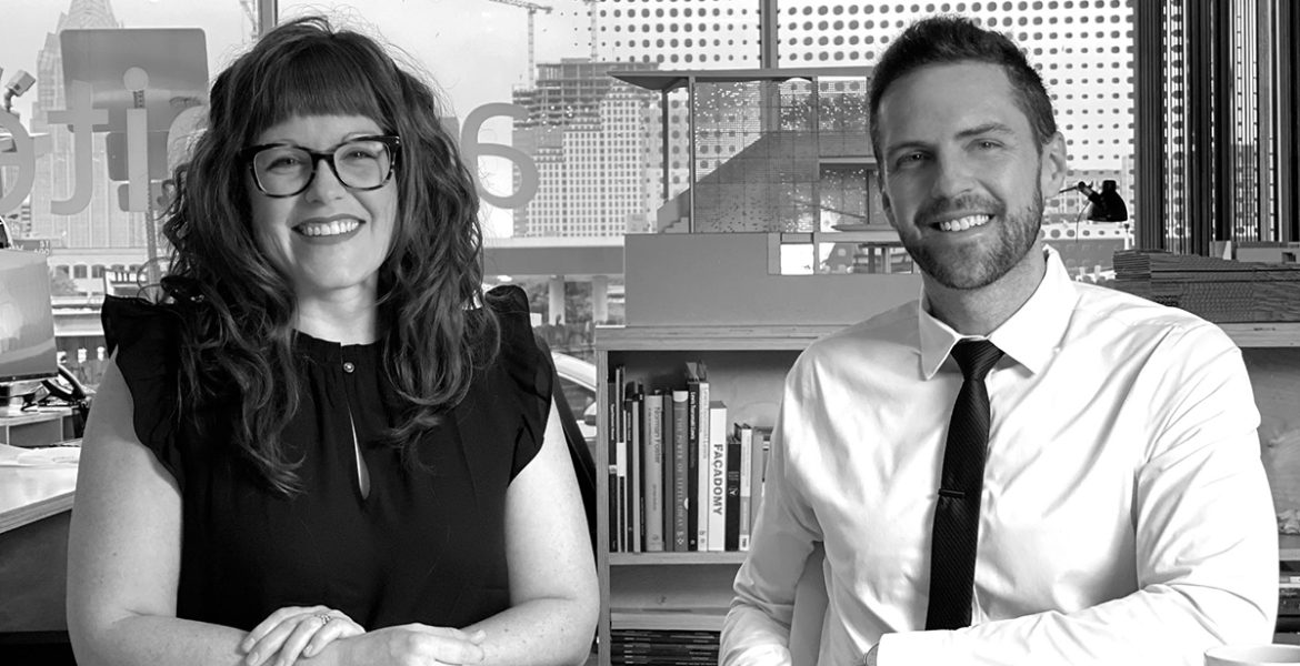 Architects Sarah Johnson and Matt Fajkus sitting at a table with blueprints.