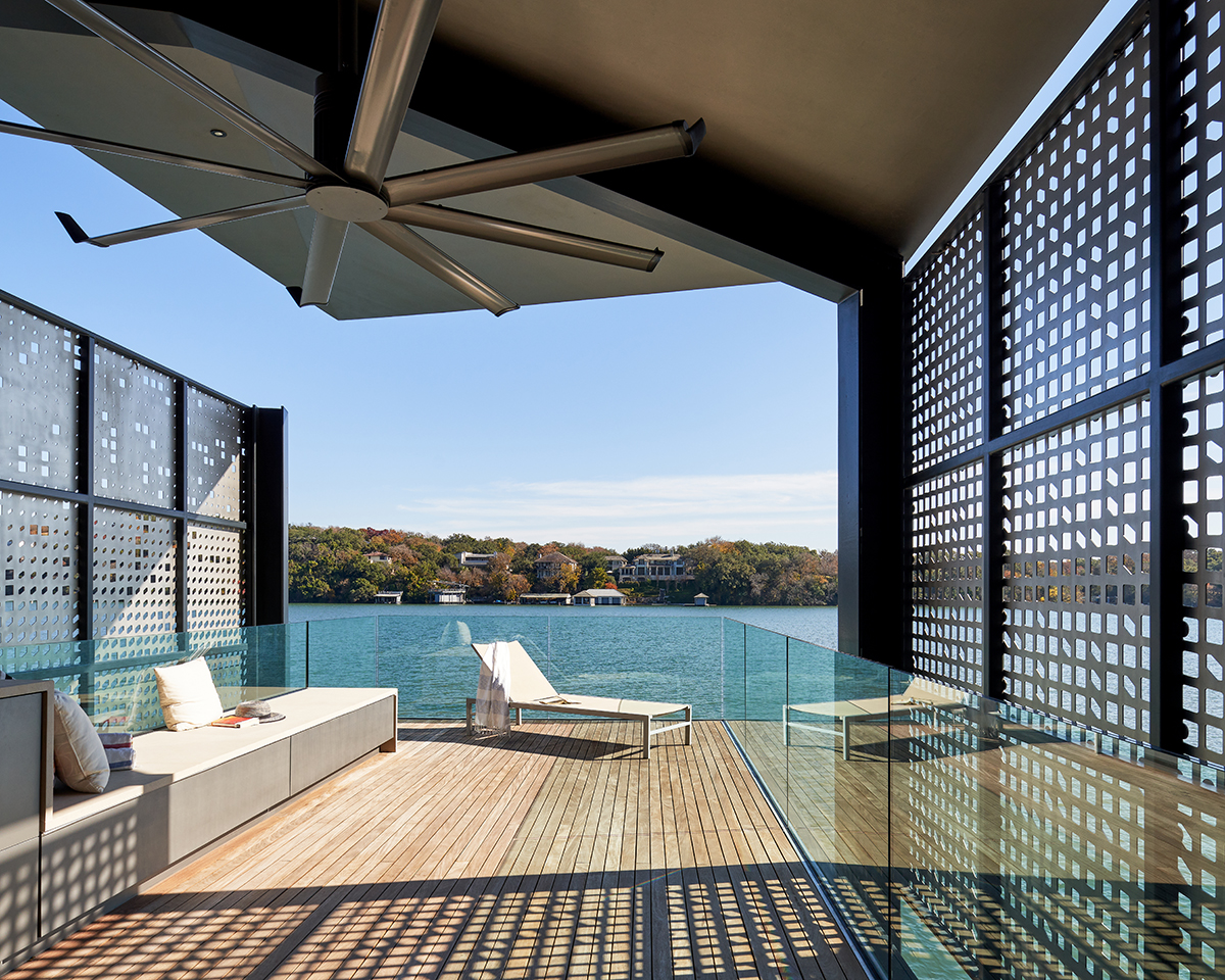 dock with lounge chair overlooking lake on sunny day