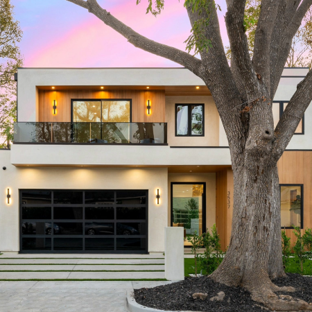 Rectangular modern home in urban area with wood and concrete facade
